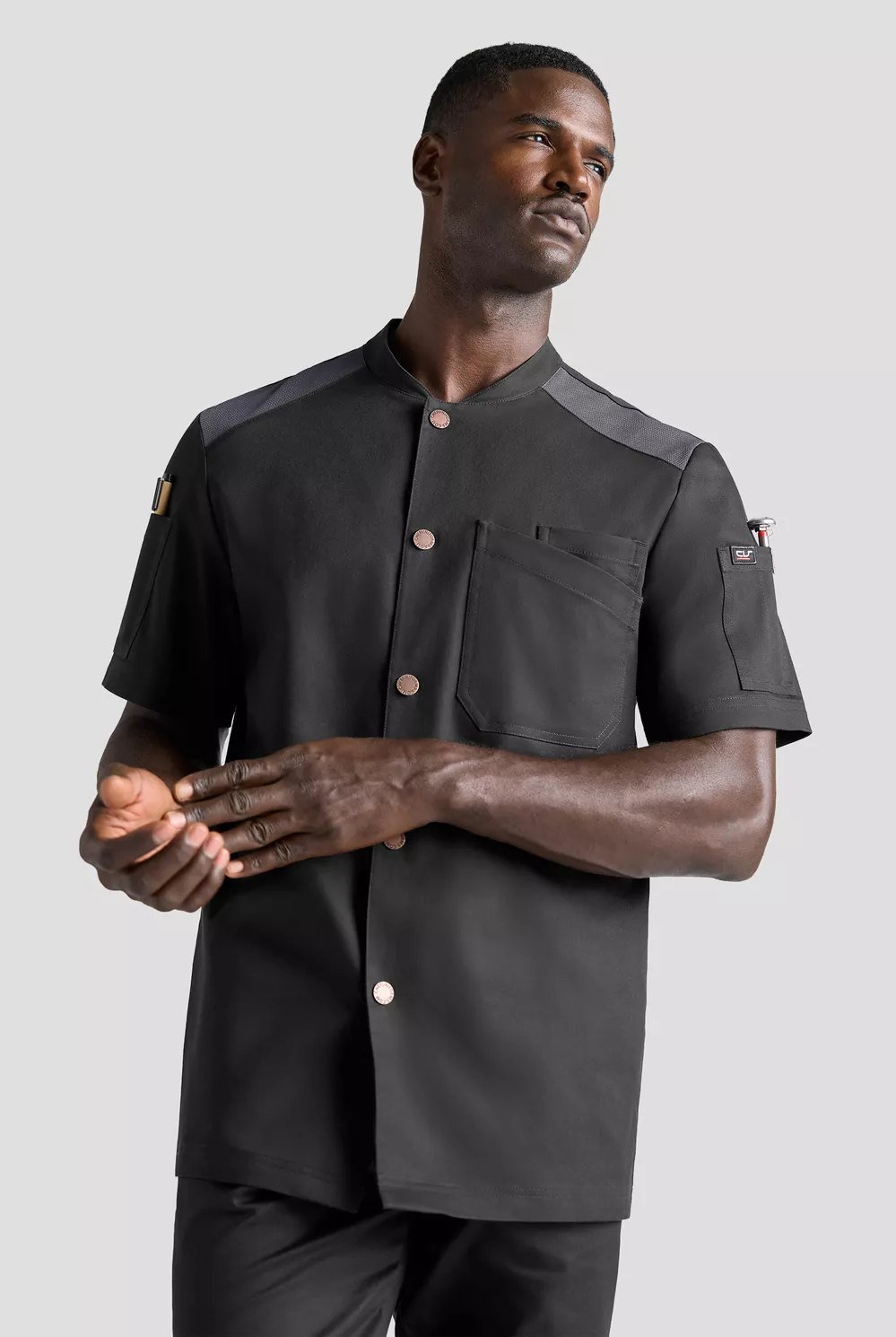 Chaqueta utilitaria elástica de manga corta para hombre